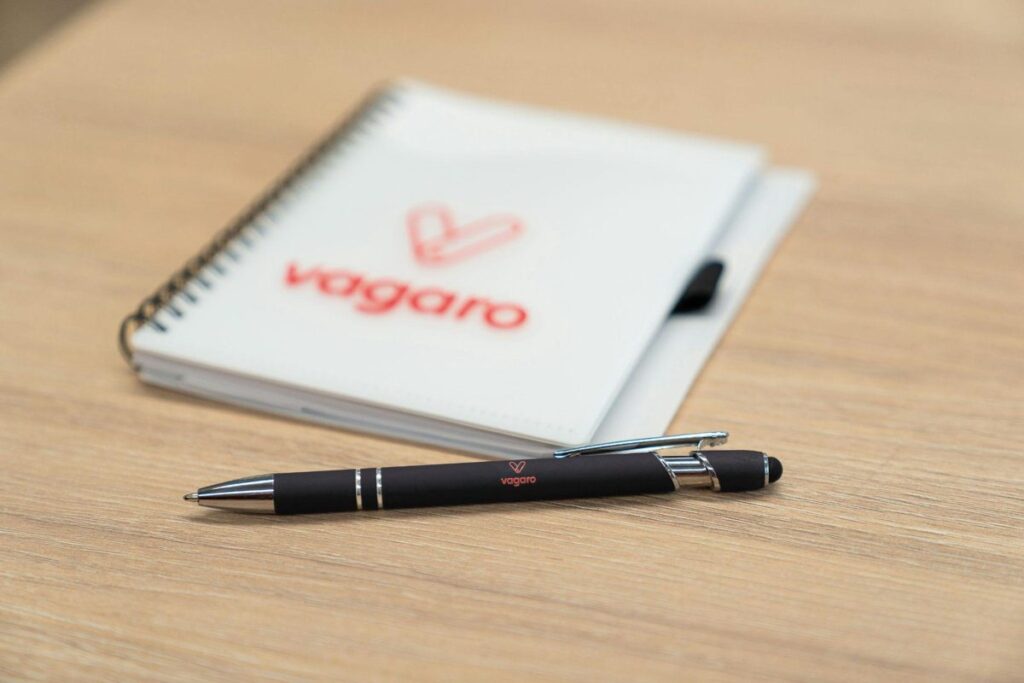 Branded notebook and pen, a popular corporate giveaway for conferences and events